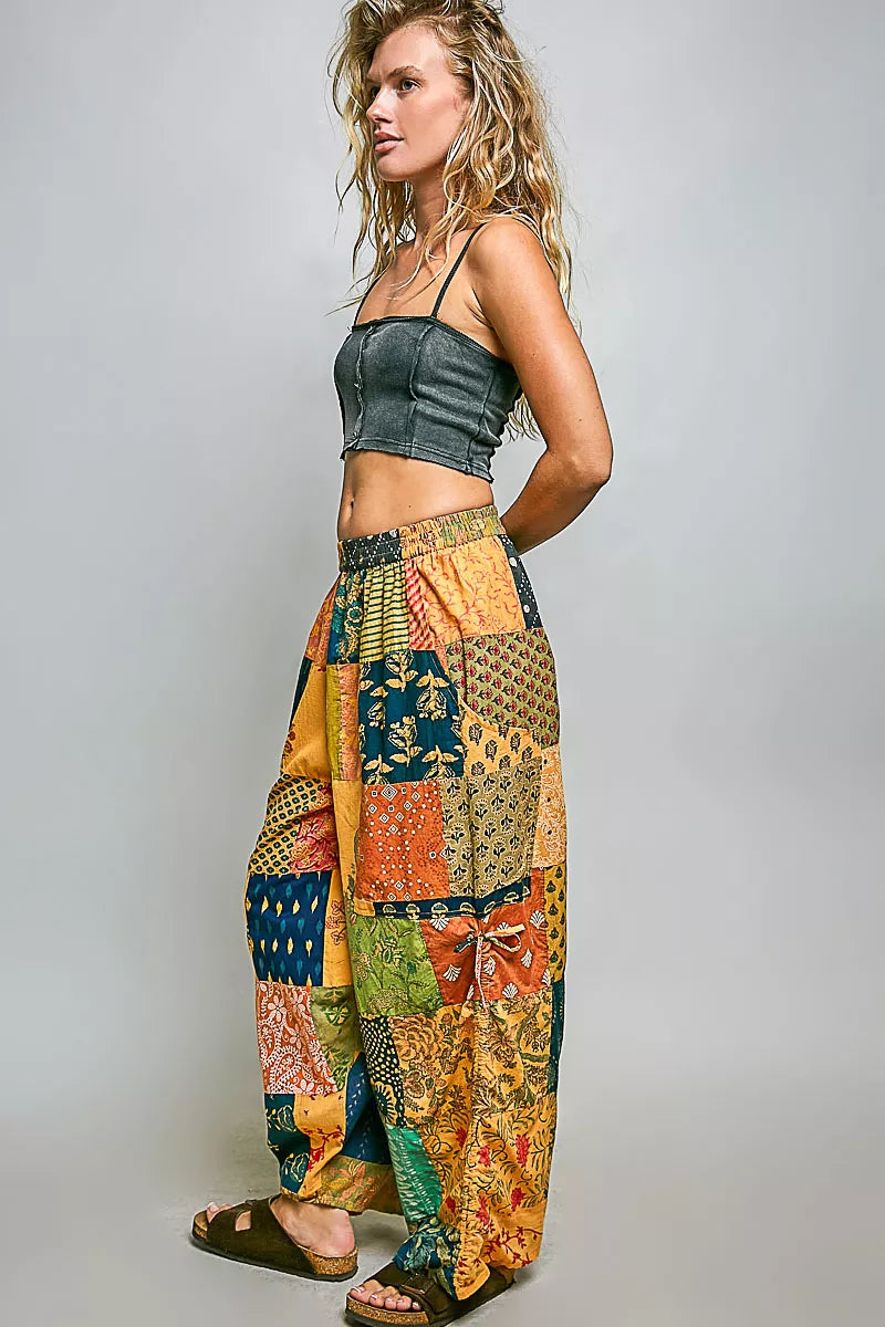 Cotton printed patchwork wide-leg pants with side drawstring from Plush Fashion Hub, displayed on a hanger or model.
