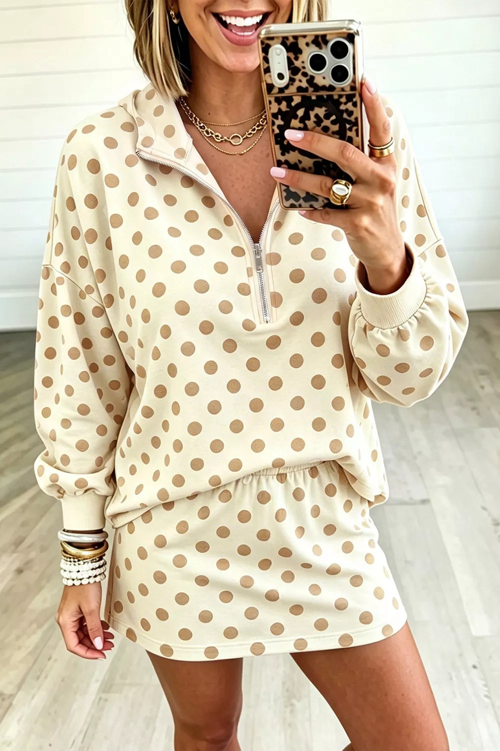 Polka dot quarter zip sweatshirt and shorts set for women by Trendsi, featuring a stylish matching loungewear look.
