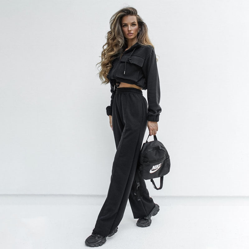 Elegant women's autumn winter long sleeve top with zipper detail, paired with casual trousers, from Bella Mia.