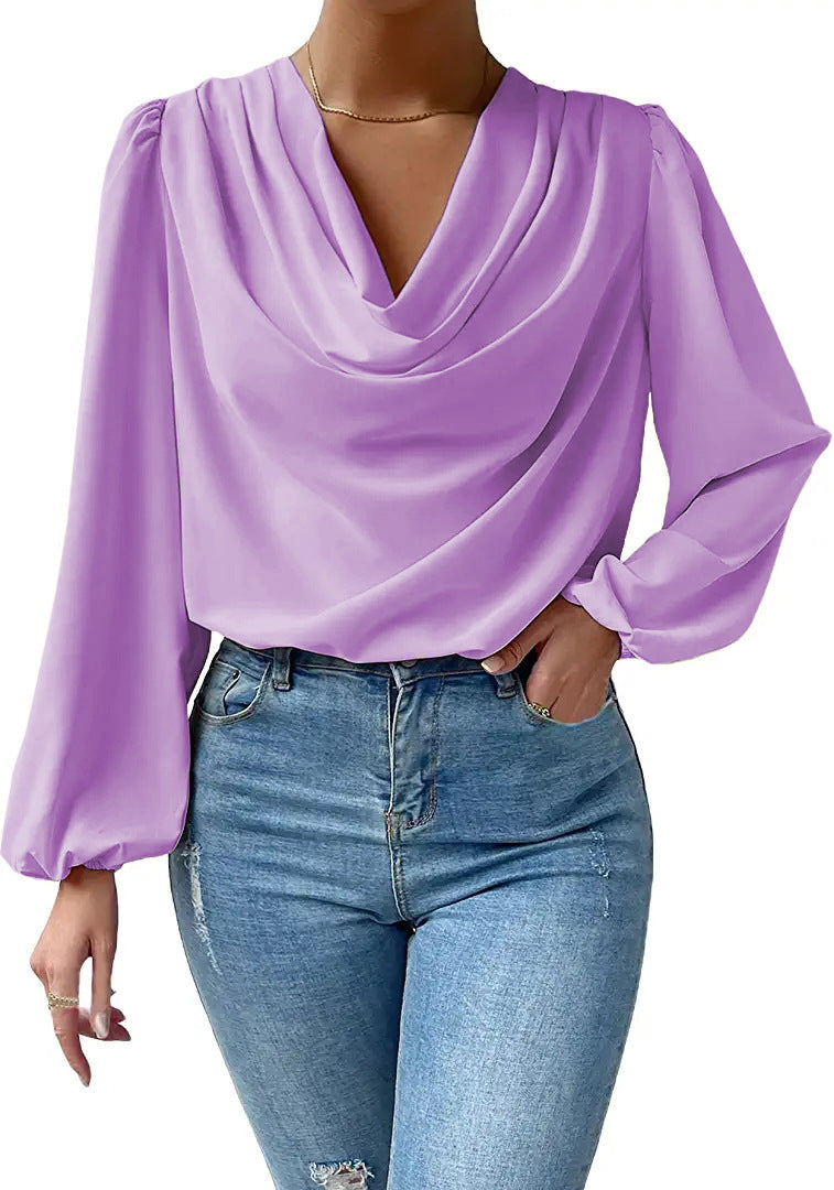 Loose draped V-neck long-sleeved shirt for women by Bella Mia, stylish and comfortable top with a relaxed fit.