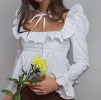 Bella Mia summer wind women’s solid color long sleeve ruffled shirt, stylish and lightweight top with feminine ruffle details.