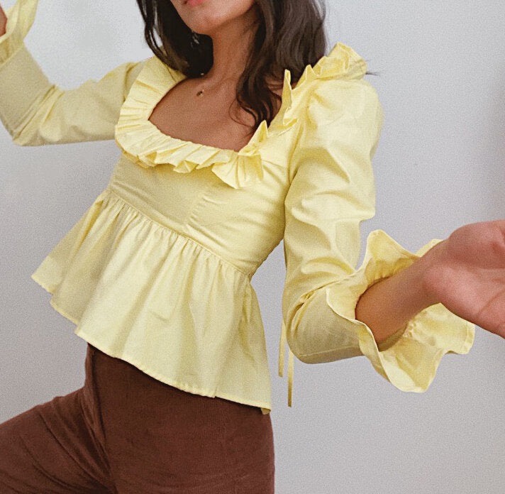 Bella Mia summer wind women's long sleeve ruffled shirt in solid color, stylish and lightweight for warm weather.