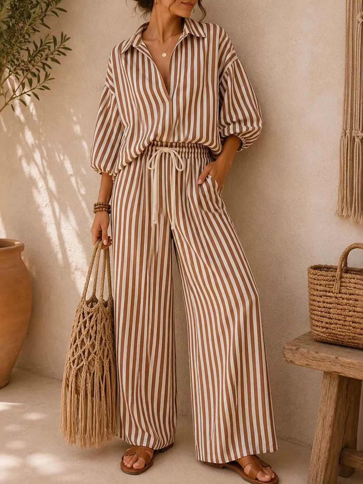 Plus size striped puff sleeve shirt with wide-leg drawstring pants set by Trendsi, featuring bold stripes and comfortable fit.
