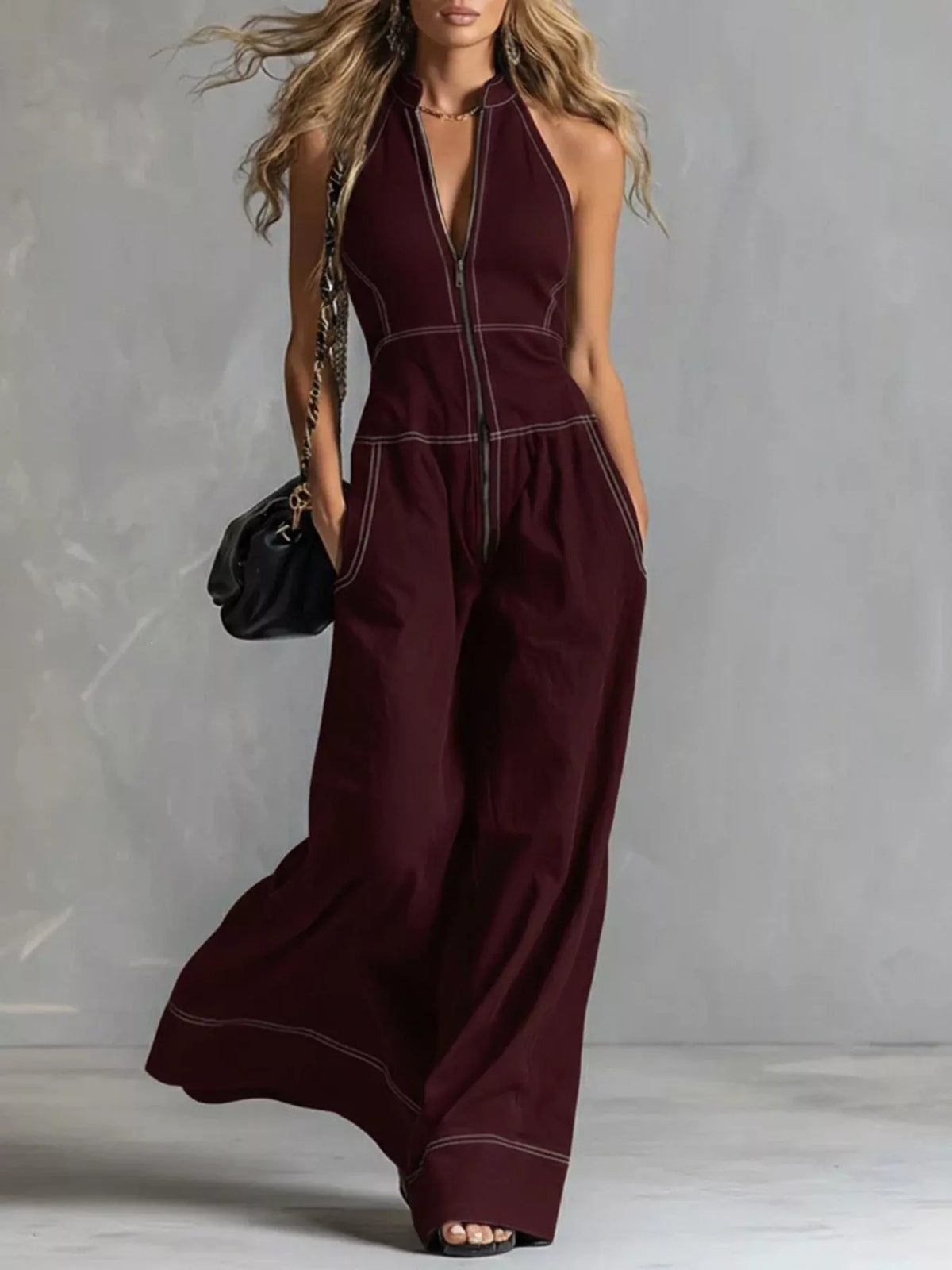 Sleeveless wide-leg jumpsuit with a zip front from Trendsi, displayed on a hanger against a neutral background.