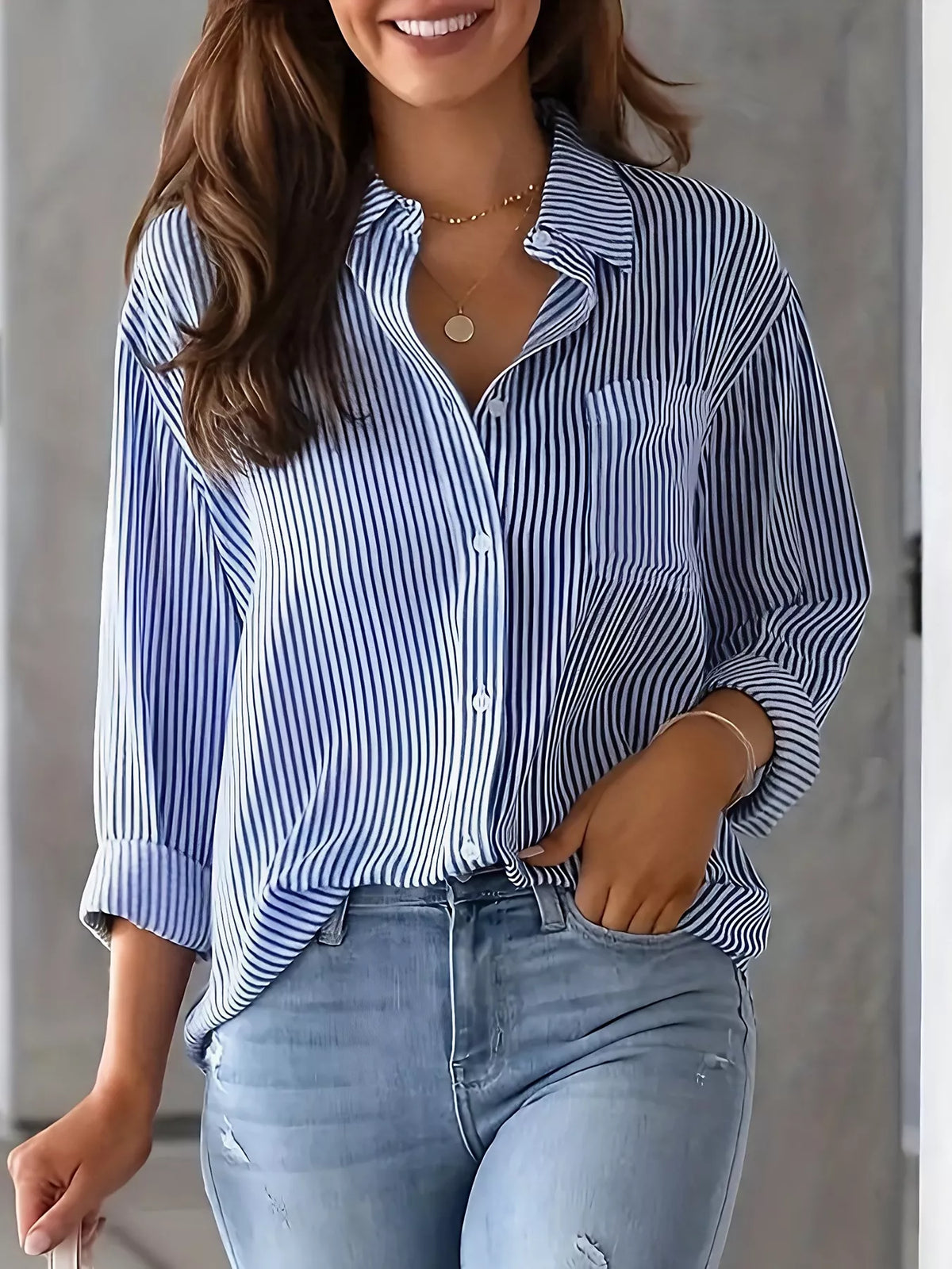 Classic striped button-down women's shirt from Trendsi, featuring a collared design and long sleeves, displayed flat on a white background.