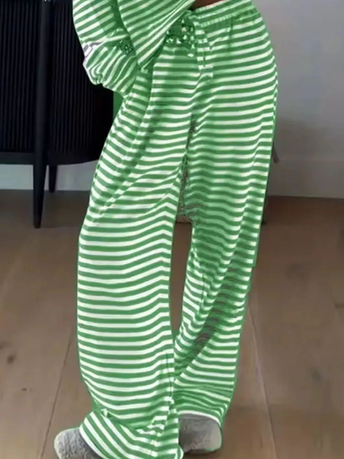 Striped dropped shoulder top and matching pants set by Trendsi, featuring relaxed fit and casual style.