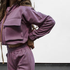 Bella Mia casual women's trousers and long sleeve top set with solid color, zipper double bag, and drawstring details.