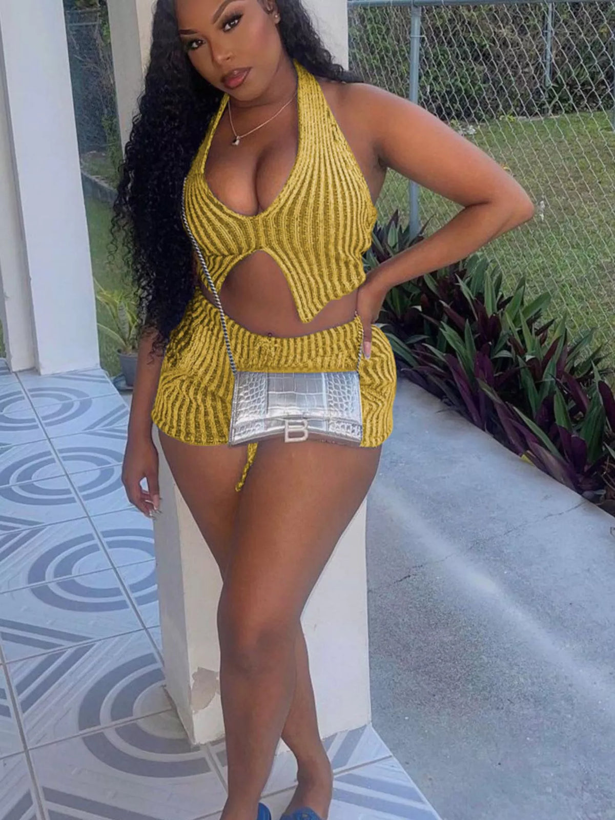 Halter neck sweater top with matching shorts from Plush Fashion Hub two-piece set, featuring cozy knit fabric and stylish design.