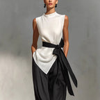 Women's white lace-up sleeveless top and wide-leg pants two-piece casualwear set by FitiqueFit, displayed on a model.