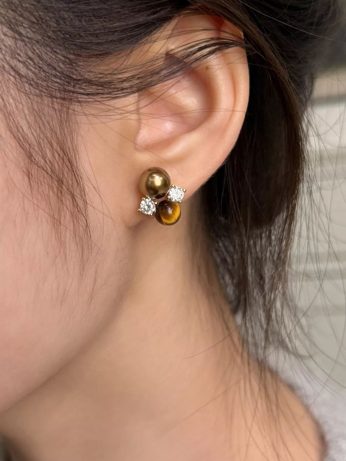 Tiger Eye stud earrings by Plush Fashion Hub, featuring polished gemstone studs in a classic jewelry design.