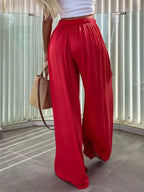 Flowy wide-leg pants from Trendsi featuring a relaxed fit, lightweight fabric, and a stylish silhouette for casual or chic wear.