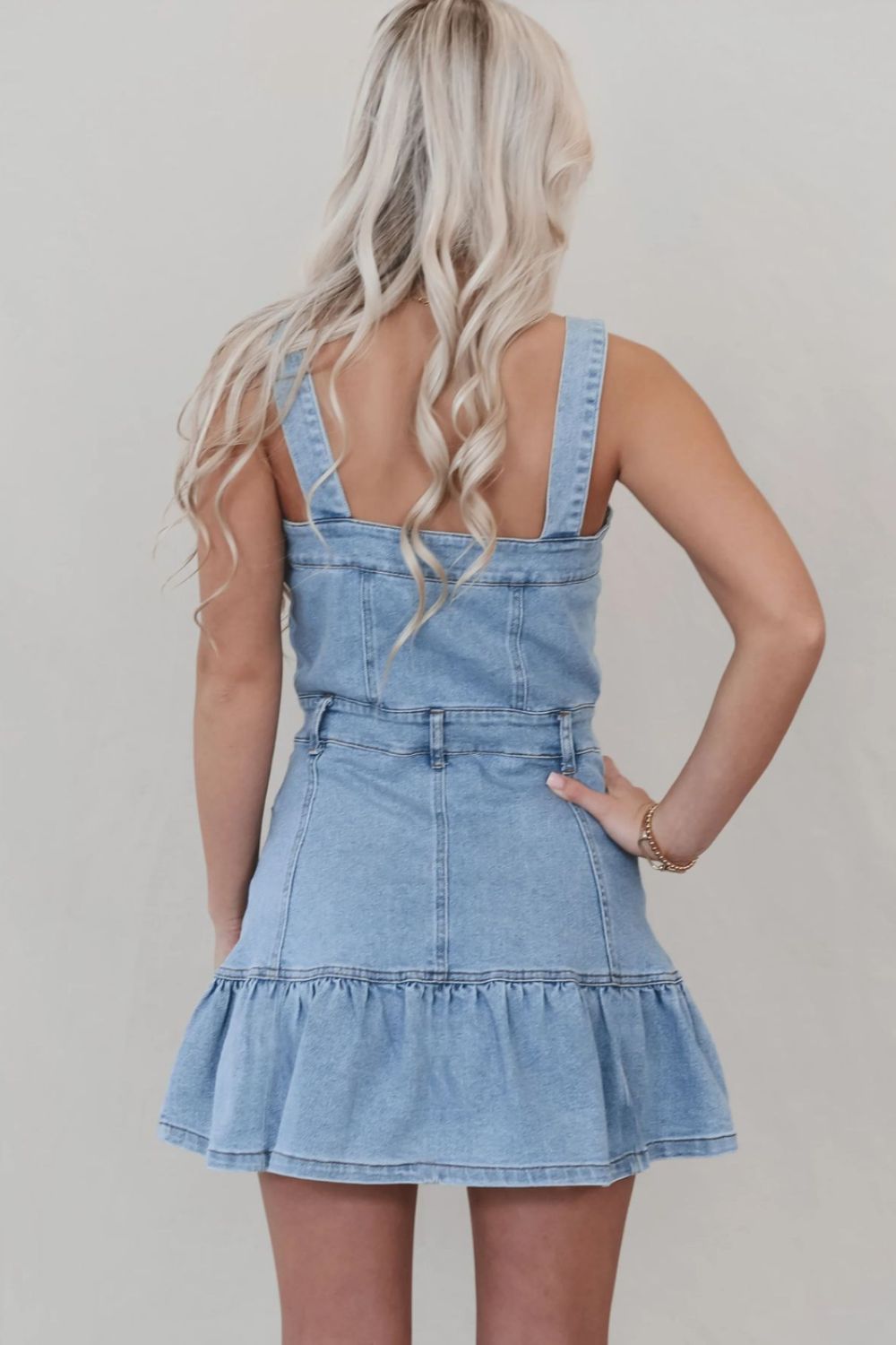 Denim dress with ruffled hem, button front, and square neckline by Plush Fashion Hub, showcasing the stylish clothing and fashion design.