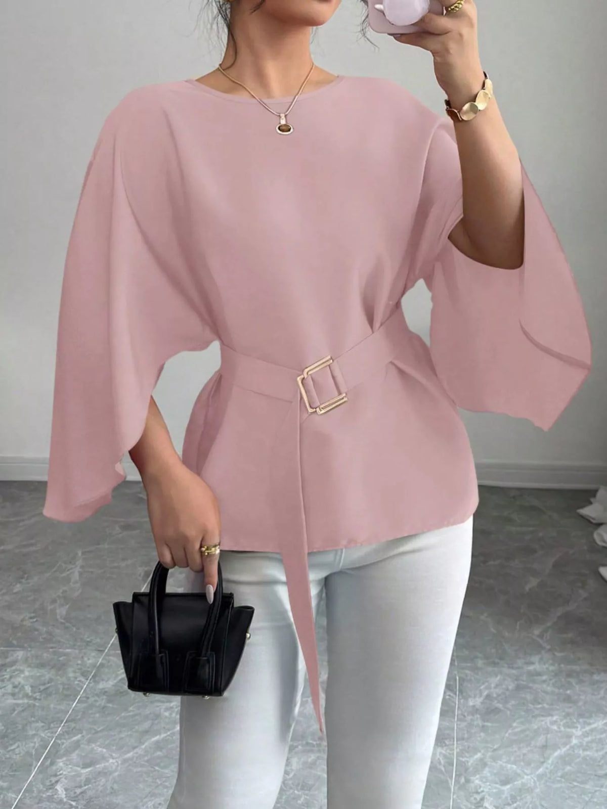 Black batwing sleeve belted blouse from Plush Fashion Hub, featuring a relaxed fit and stylish design on a model.