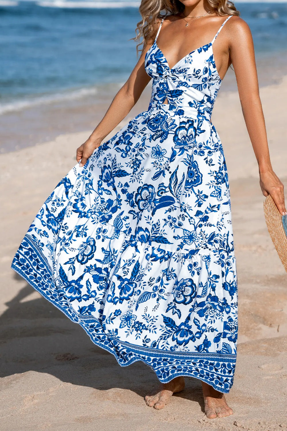 Floral print twisted front backless maxi dress by Plush Fashion Hub featuring cutout back and flowing skirt.