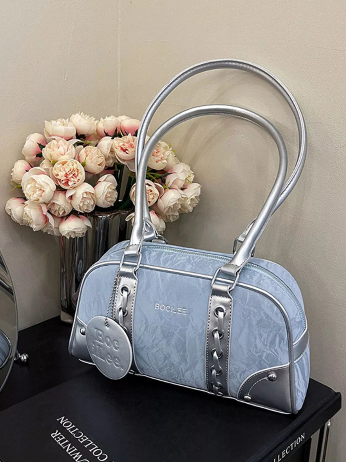 Plush Fashion Hub top handle shoulder bag in sleek design, featuring a structured shape and elegant shoulder strap.
