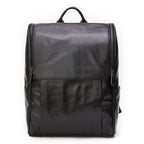Black Pi-Mart leather computer backpack with a sleek first layer leather design, featuring multiple compartments and padded straps.