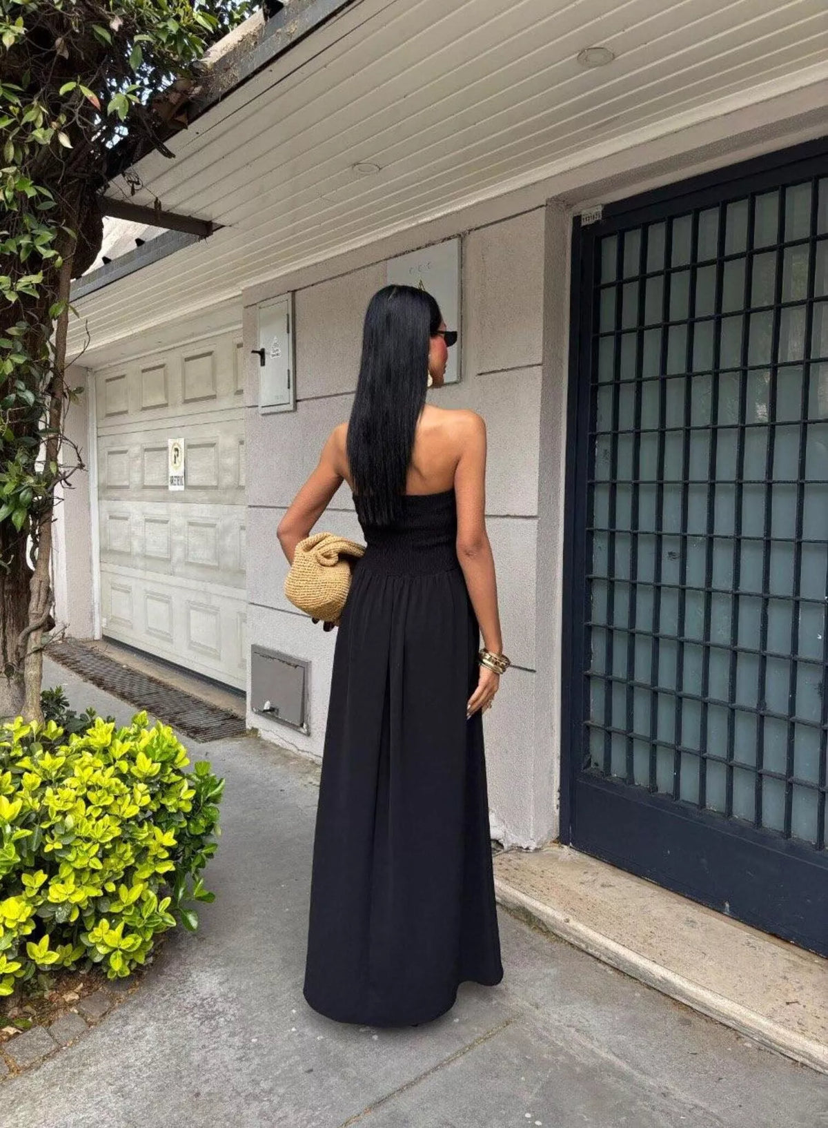 Strapless smocked maxi dress by Plush Fashion Hub featuring a flowing silhouette and floral pattern, perfect for summer wear.