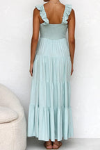 Women's cotton ruffled V-neck tiered midi dress with short sleeves and floral pattern, from Trendsi.