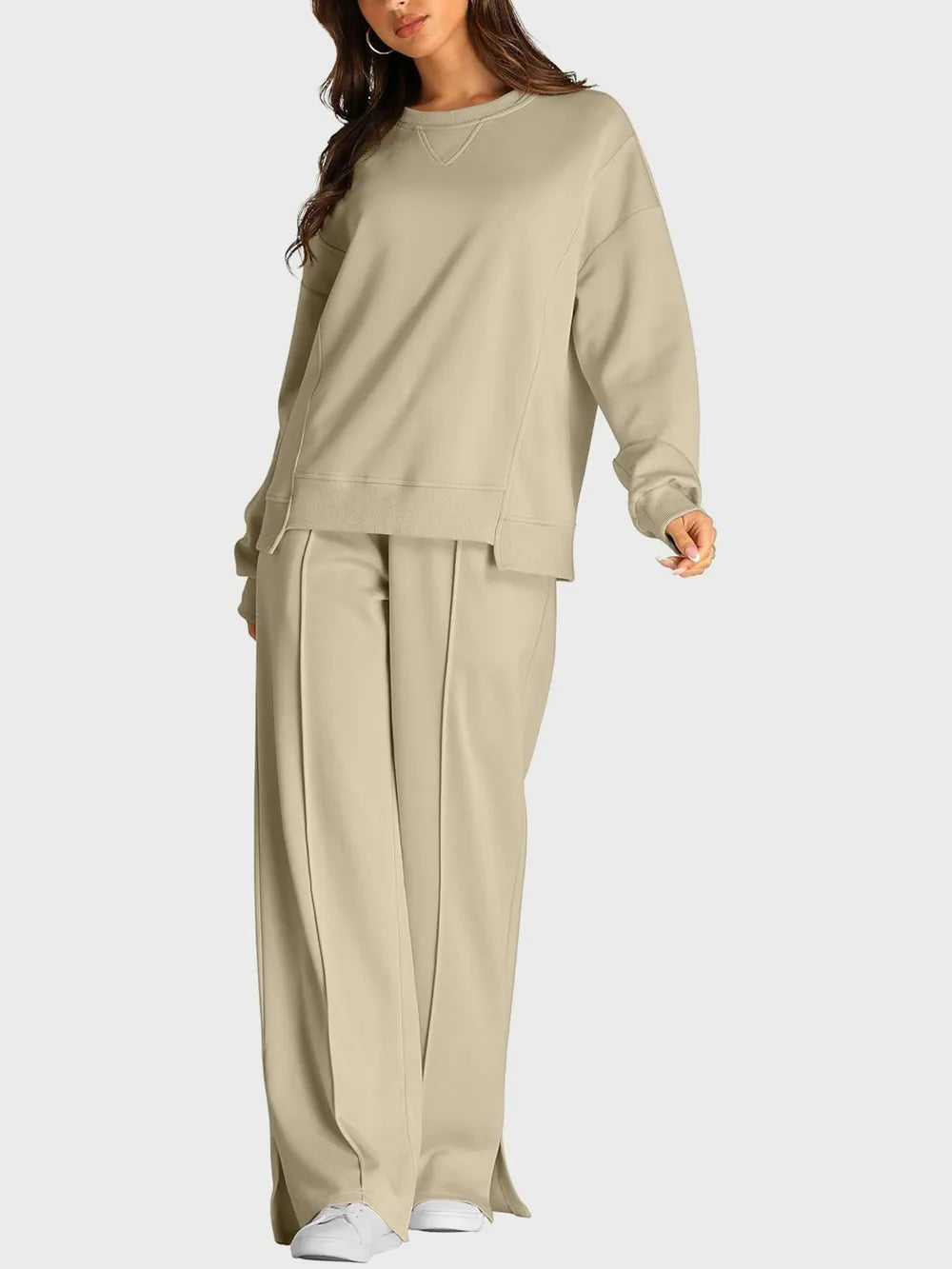 Trendsi round neck long sleeve top and slit pants set, stylish matching clothing with a comfortable fit and modern design.