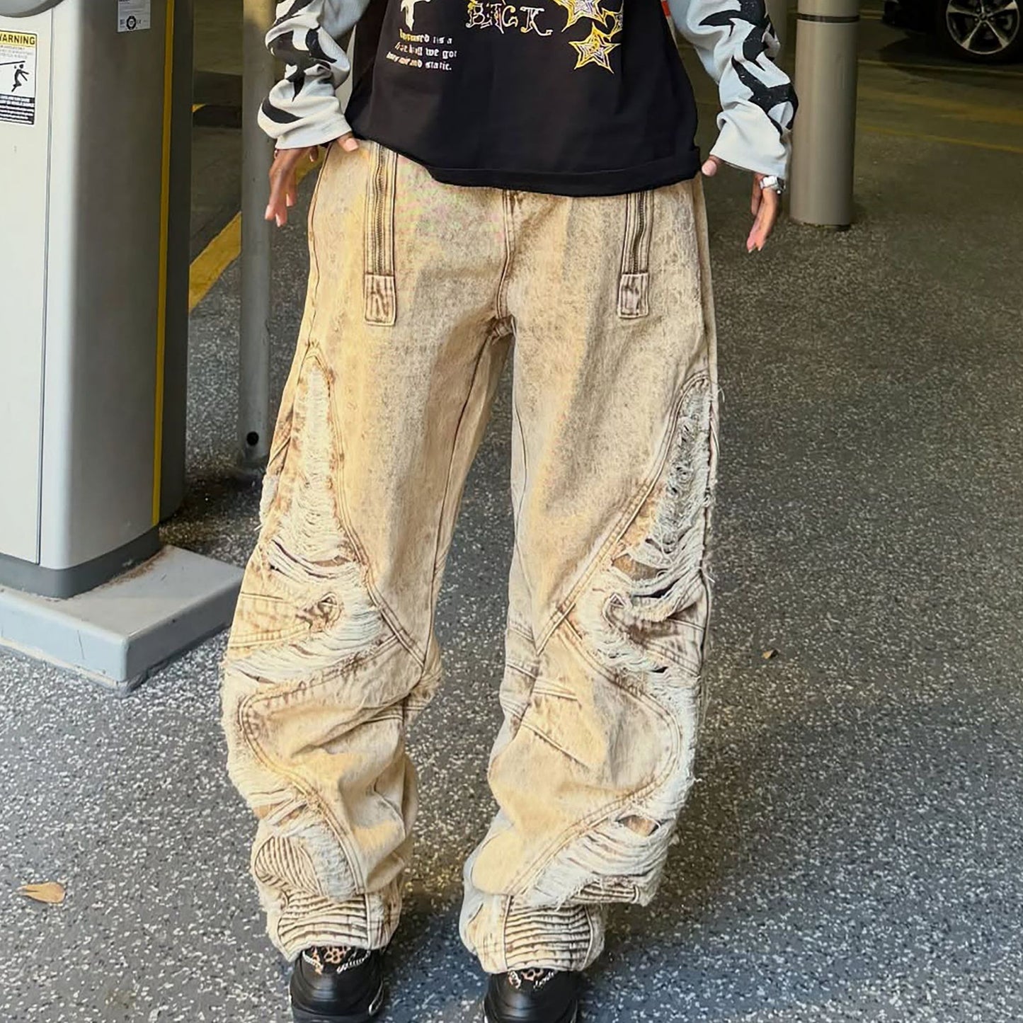Distressed irregular hem ripped jeans by eprolo featuring a casual fit and heavily shredded distressed details.
