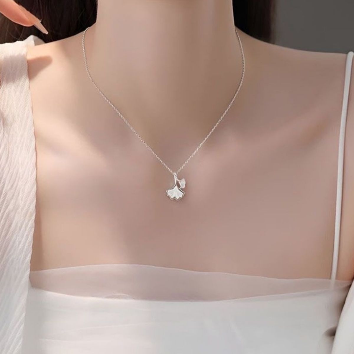 Ginkgo leaf pendant necklace from Plush Fashion Hub, featuring a delicate gold-tone ginkgo leaf charm on a fine chain.