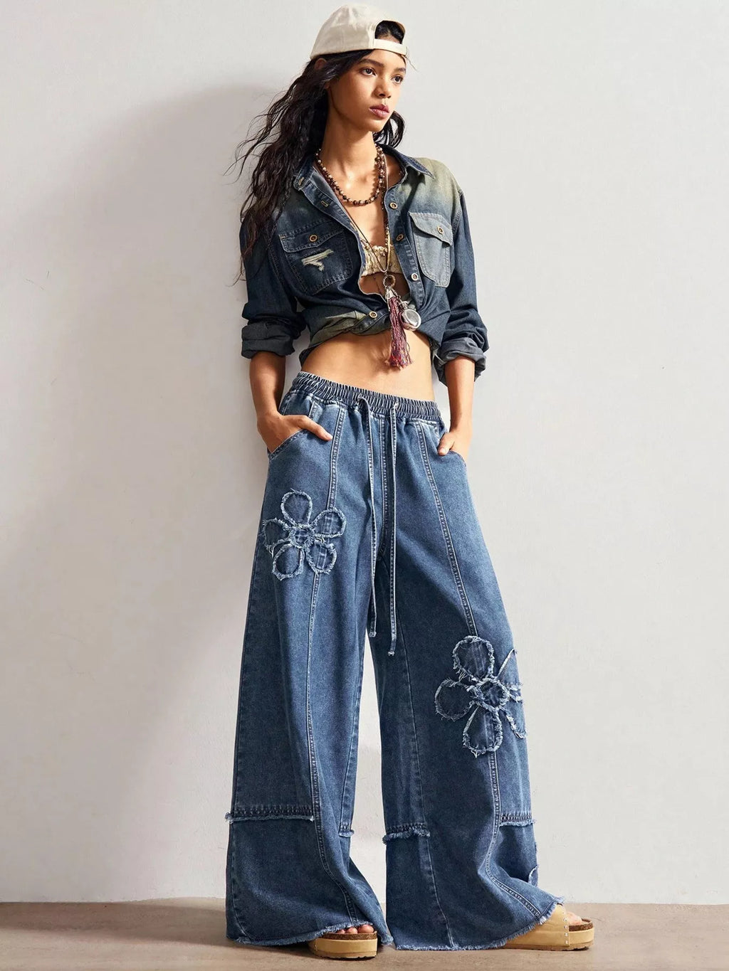 Shopimist floral appliques wide leg jeans showing detailed floral embroidery on light denim with a relaxed fit.
