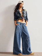 Shopimist floral appliques wide leg jeans showing detailed floral embroidery on light denim with a relaxed fit.