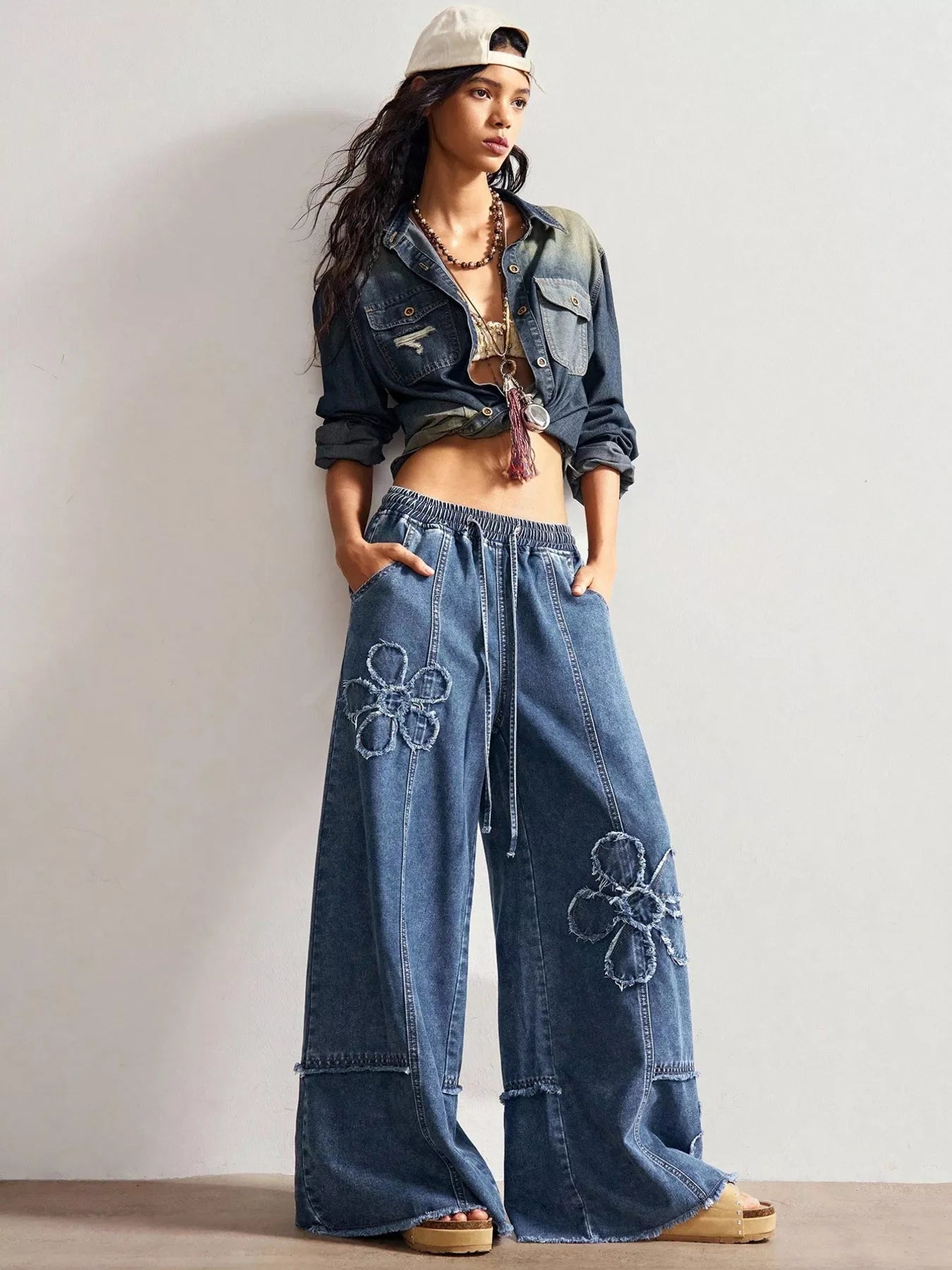Shopimist floral appliques wide leg jeans showing detailed floral embroidery on light denim with a relaxed fit.