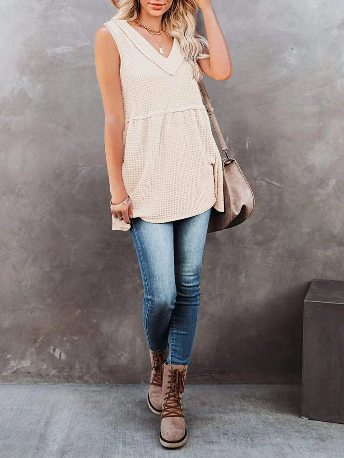 V-neck waffle knit tank top with contrast stitching by Plush Fashion Hub, featuring a fitted sleeveless design and textured fabric.