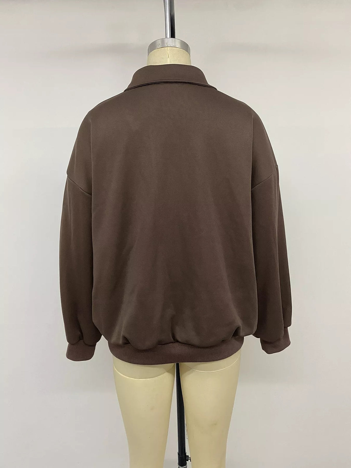 Trendsi polo collar dropped shoulder sweatshirt featuring a relaxed fit, soft fabric, and stylish design in a casual, comfortable style.