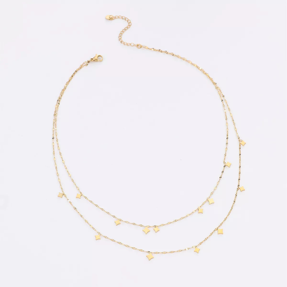 18K gold plated layered star charm necklace featuring multiple star pendants on a delicate chain, designed by Plush Fashion Hub.