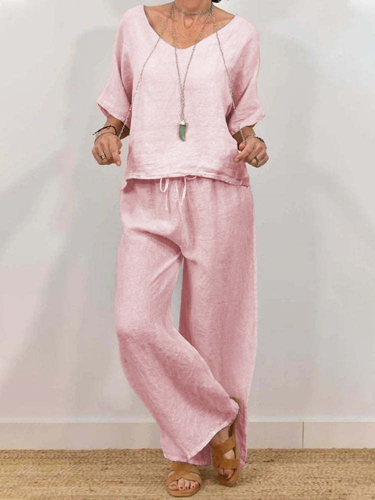 Women’s multi-color two-piece casualwear set with V-neck top and pants by Plush Fashion Hub, featuring vibrant fabric and comfortable fit.