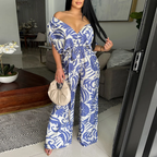 Women’s off-shoulder batwing sleeve printed jumpsuit by Bella Mia, featuring wide-leg design and stylish pattern.