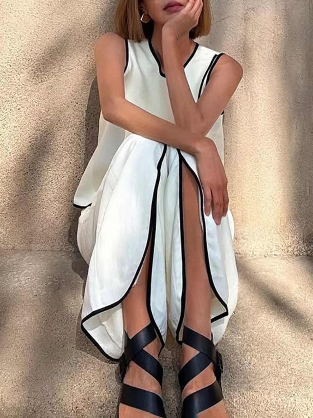 Contrast trim sleeveless top and wide-leg pants set by Plush Fashion Hub, featuring a stylish two-piece outfit with bold accents.