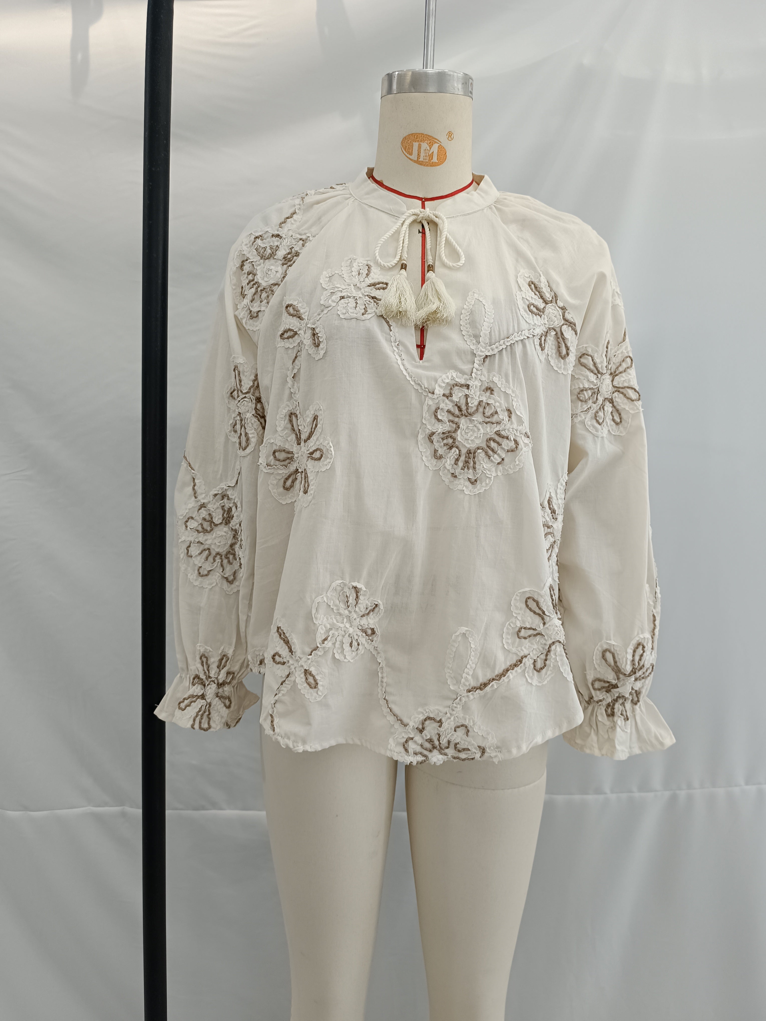 Bella Mia women's spring floral embroidered mini shirt with delicate ring accents, perfect for stylish spring outfits.
