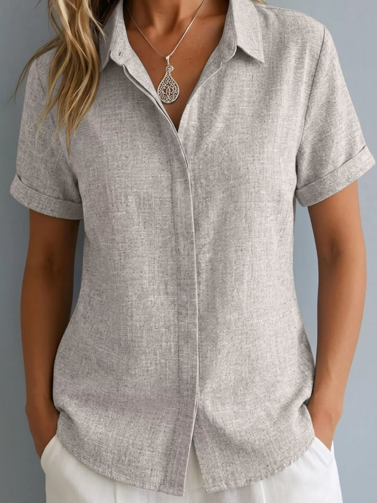Plus size collared short sleeve shirt from Trendsi, showing a stylish top with a classic collar and short sleeves.