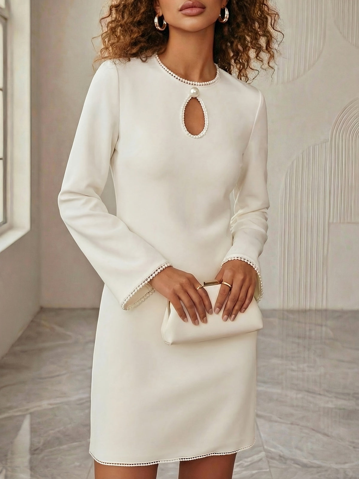 Elegant Plush Fashion Hub mini dress with keyhole neckline and pearl trim, perfect for cocktail parties.