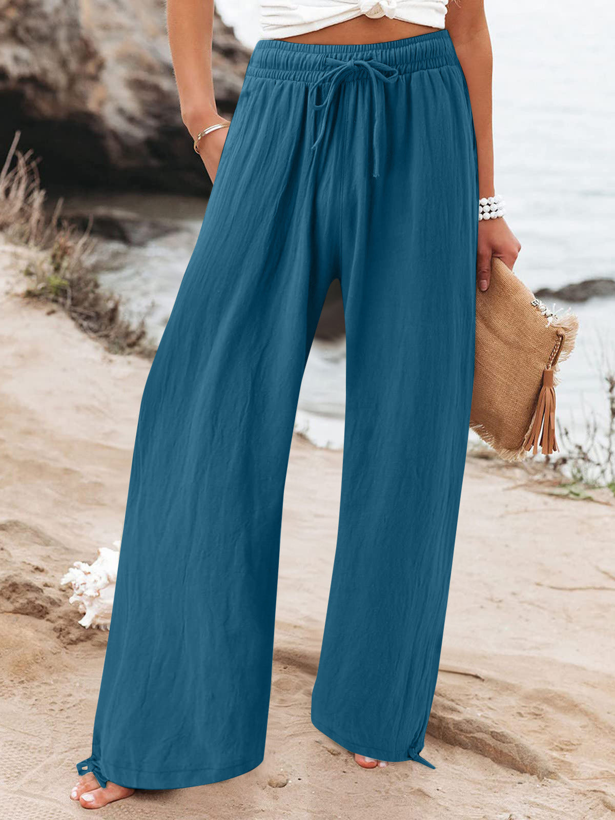 Plus size full length drawstring wide-leg pants by Trendsi, showing relaxed fit and comfortable waistband on a model.