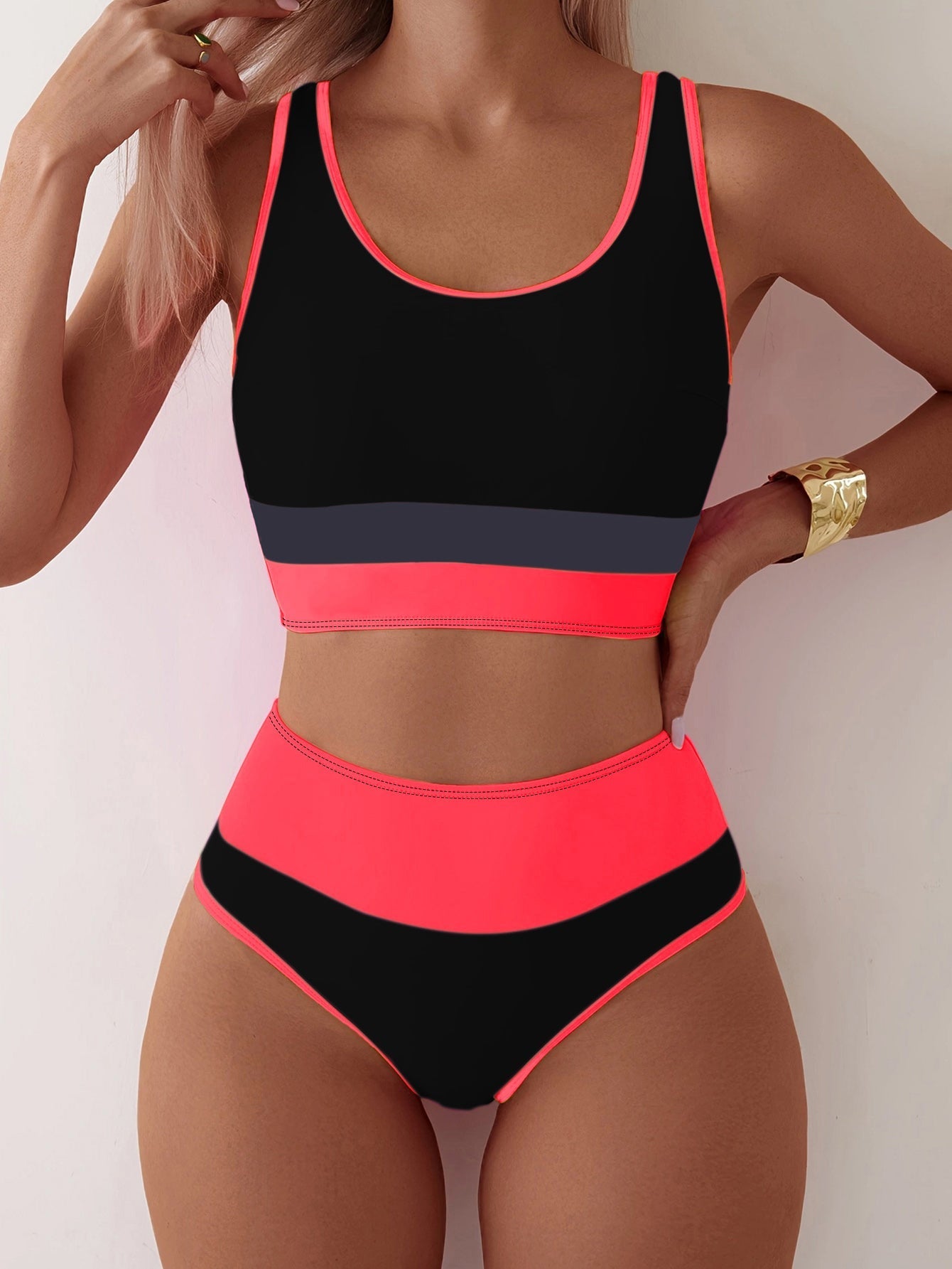 Women’s backless contrast color swimsuit two-piece set by Bella Mia, featuring sporty design and bold color blocking.
