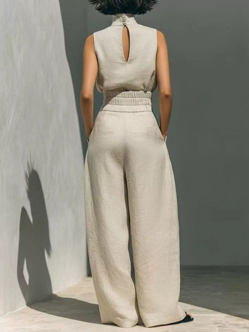 Plus size sleeveless wide-leg jumpsuit with smocked waist, featuring a full-length design from Trendsi.