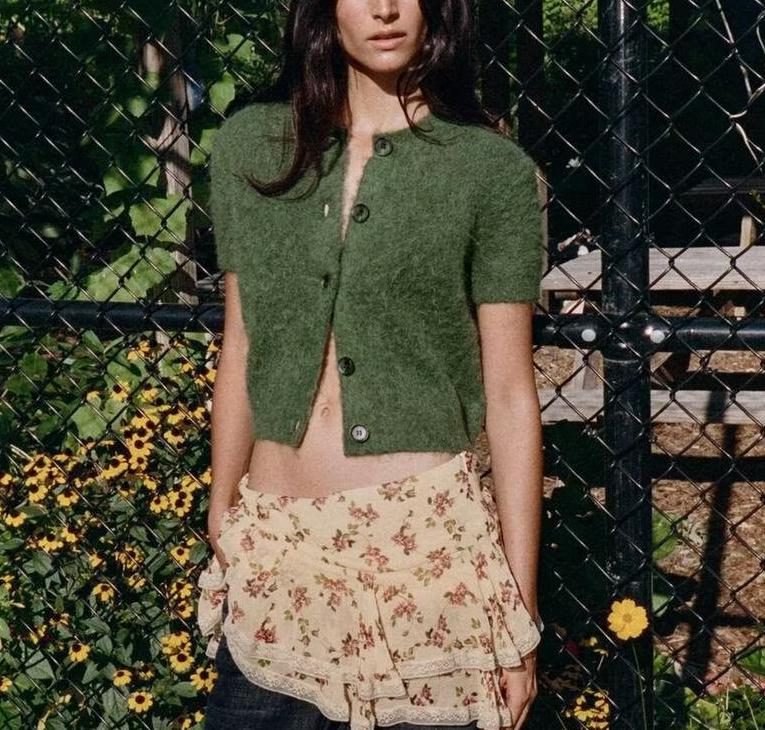 Bella Mia women's short sleeve knitwear with a round neck and single-breasted design, suitable for early autumn office wear.