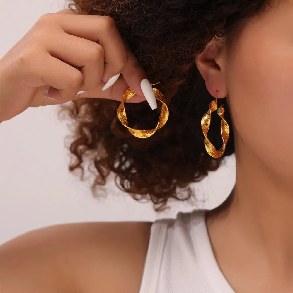 Titanium steel twisted earrings with sleek design, perfect for stylish fashion accessories, by Plush Fashion Hub.