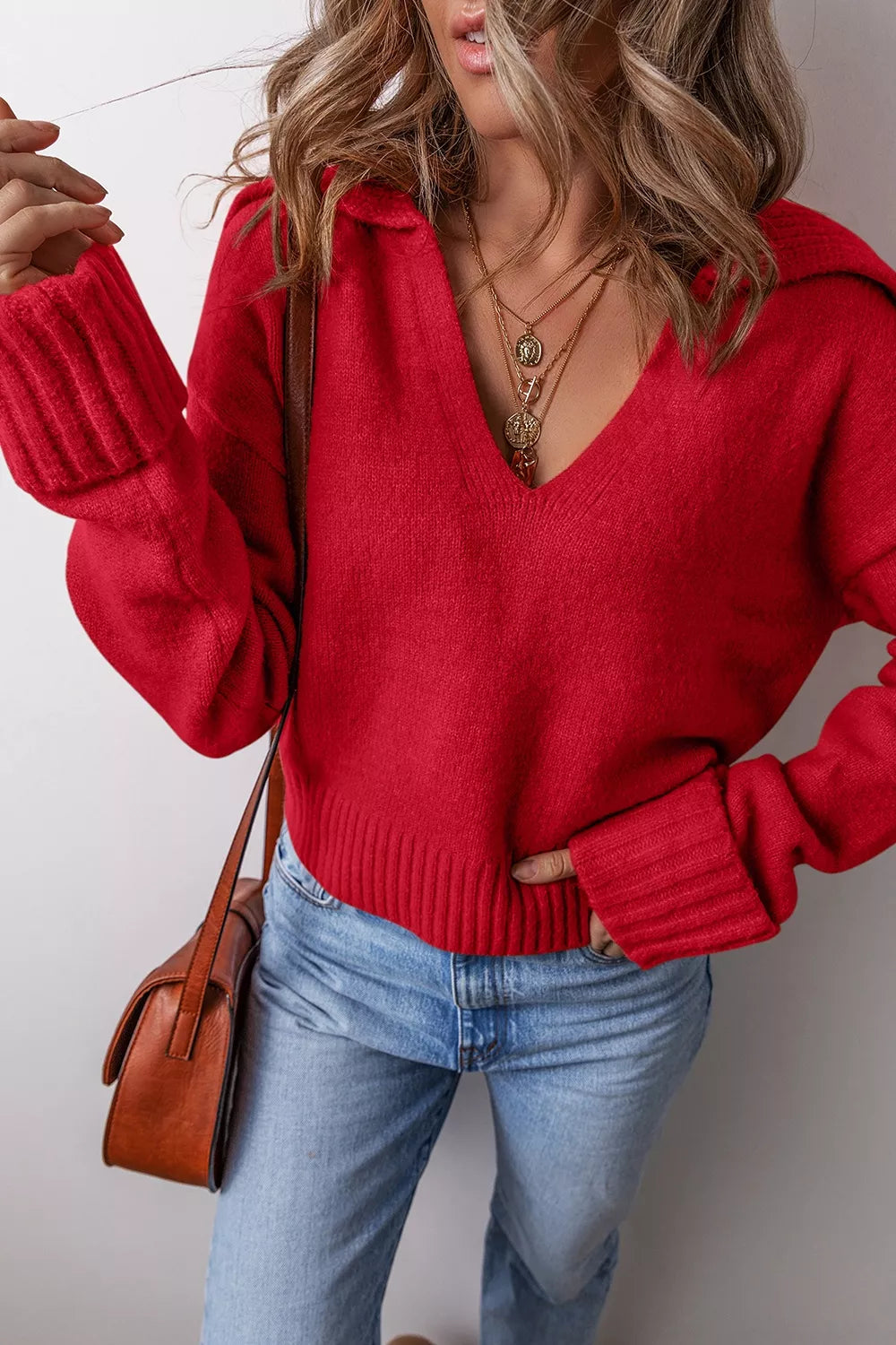 Women's ribbed hem long sleeve sweater by Trendsi, featuring a cozy knit design and fitted silhouette in a neutral color.