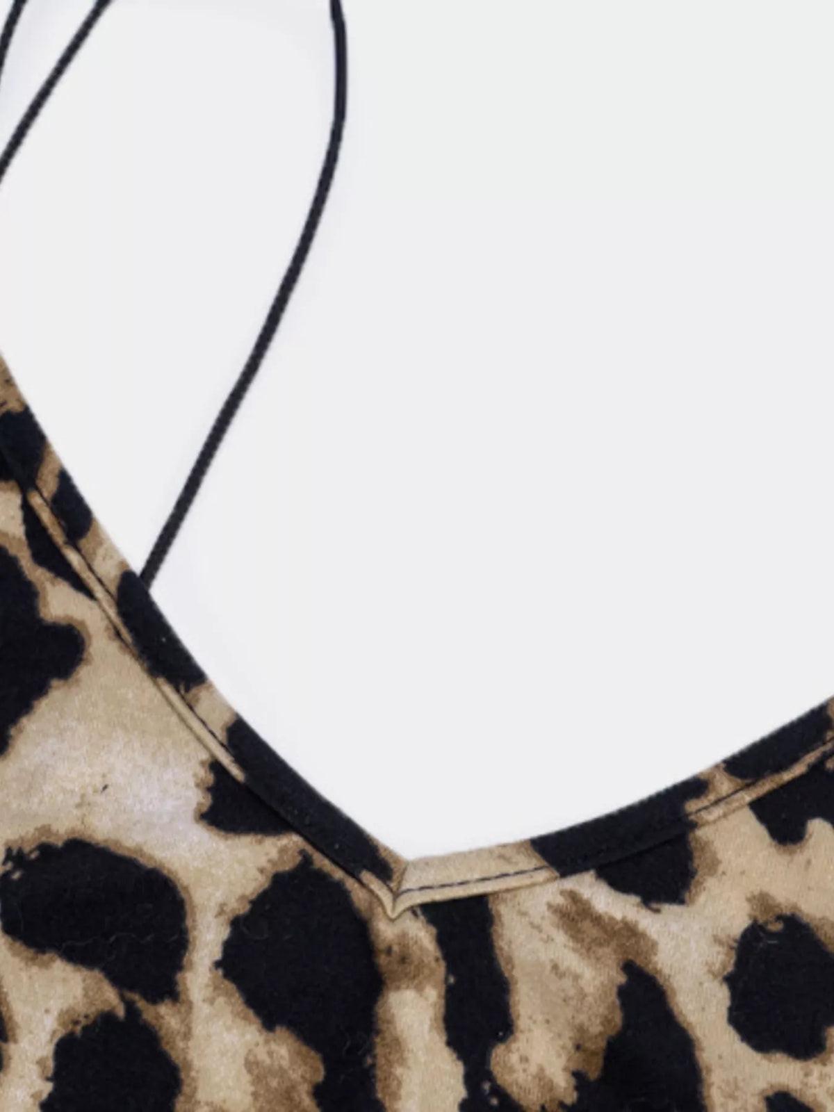 Leopard print spaghetti strap midi dress by Plush Fashion Hub, featuring a fitted silhouette and stylish design.