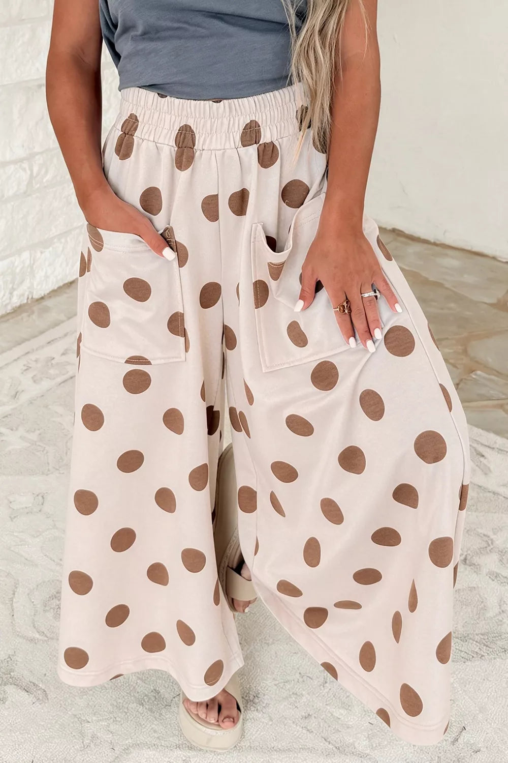 Polka dot wide-leg casual pants with elastic waist from Trendsi, featuring a relaxed fit and playful black and white pattern.