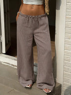 Tied striped wide-leg pants from Trendsi featuring a high waist, bold vertical stripes, and relaxed fit for casual style.