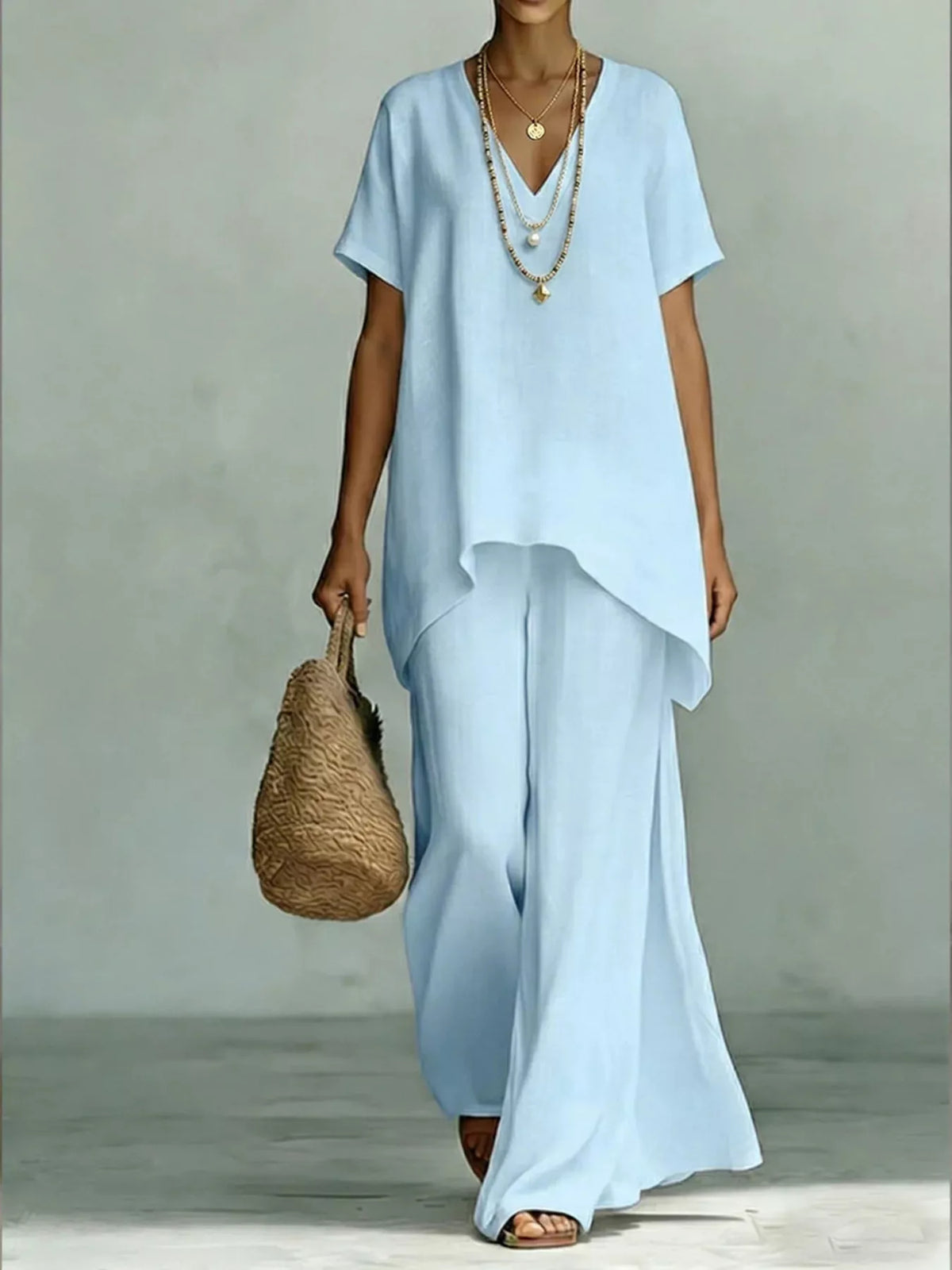Plus size V-neck top and wide-leg pants set from Plush Fashion Hub, stylish and comfortable two-piece outfit in full size.