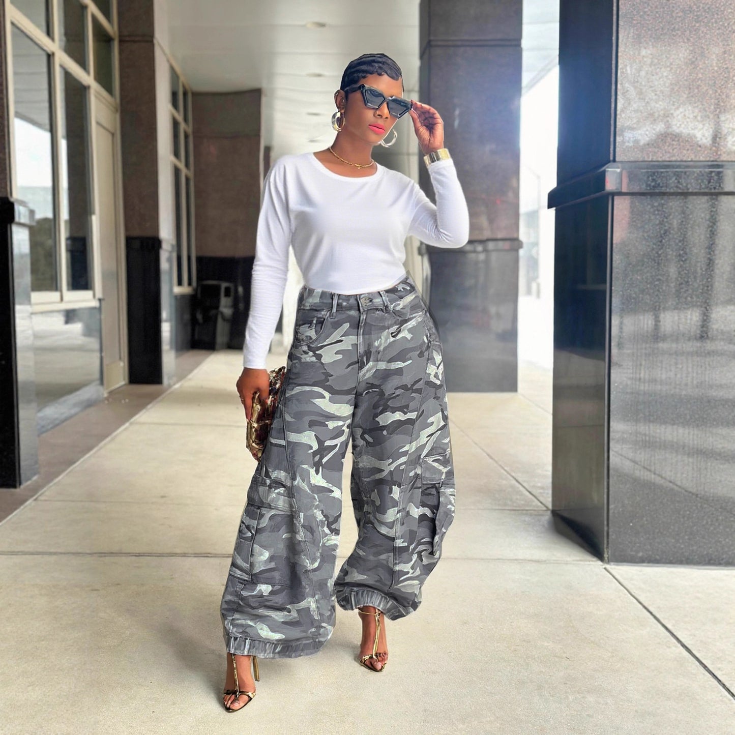 Women's camouflage wide-leg cargo denim jeans by eprolo featuring a relaxed fit and distressed details.