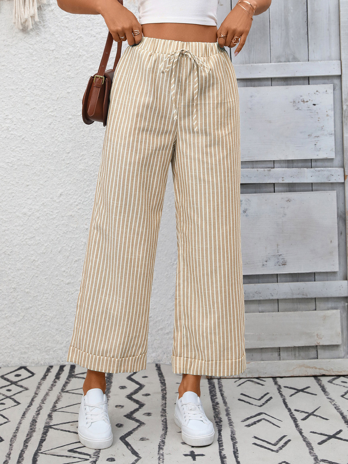 Women’s striped wide leg drawstring pants with pockets by Plush Fashion Hub, showing the relaxed fit and stylish design.