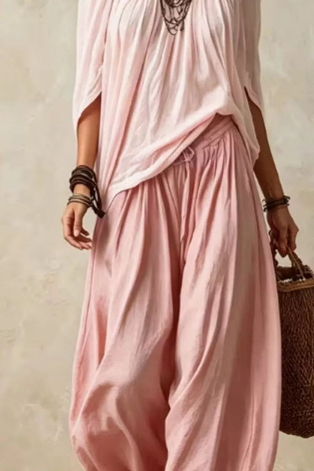 Plus size off-shoulder top and wide-leg pants matching set by Trendsi, shown in a stylish full-length view.